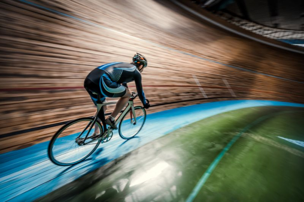 Track cyclist in velodrome