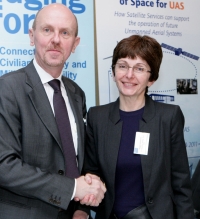 Ms Magali Vaissiere, right, director of ESA's Telecommunications and Integrated Applications directorate shakes hands with Mr. Alexander Weis, the European Defence Agency's Chief Executive.  ESA and the EDA are furthering their combined efforts into the study of satellite services for Unmanned Aircraft Systems (UAS), through the signing of contracts with two consortia to carry out parallel feasibility studies.